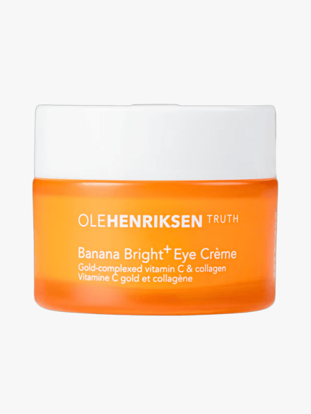 Ole Henriksen Banana Bright+ Eye Crème orange jar with white lid on light gray background