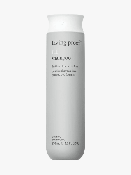 Living Proof Full Shampoo in branded component on a light gray background
